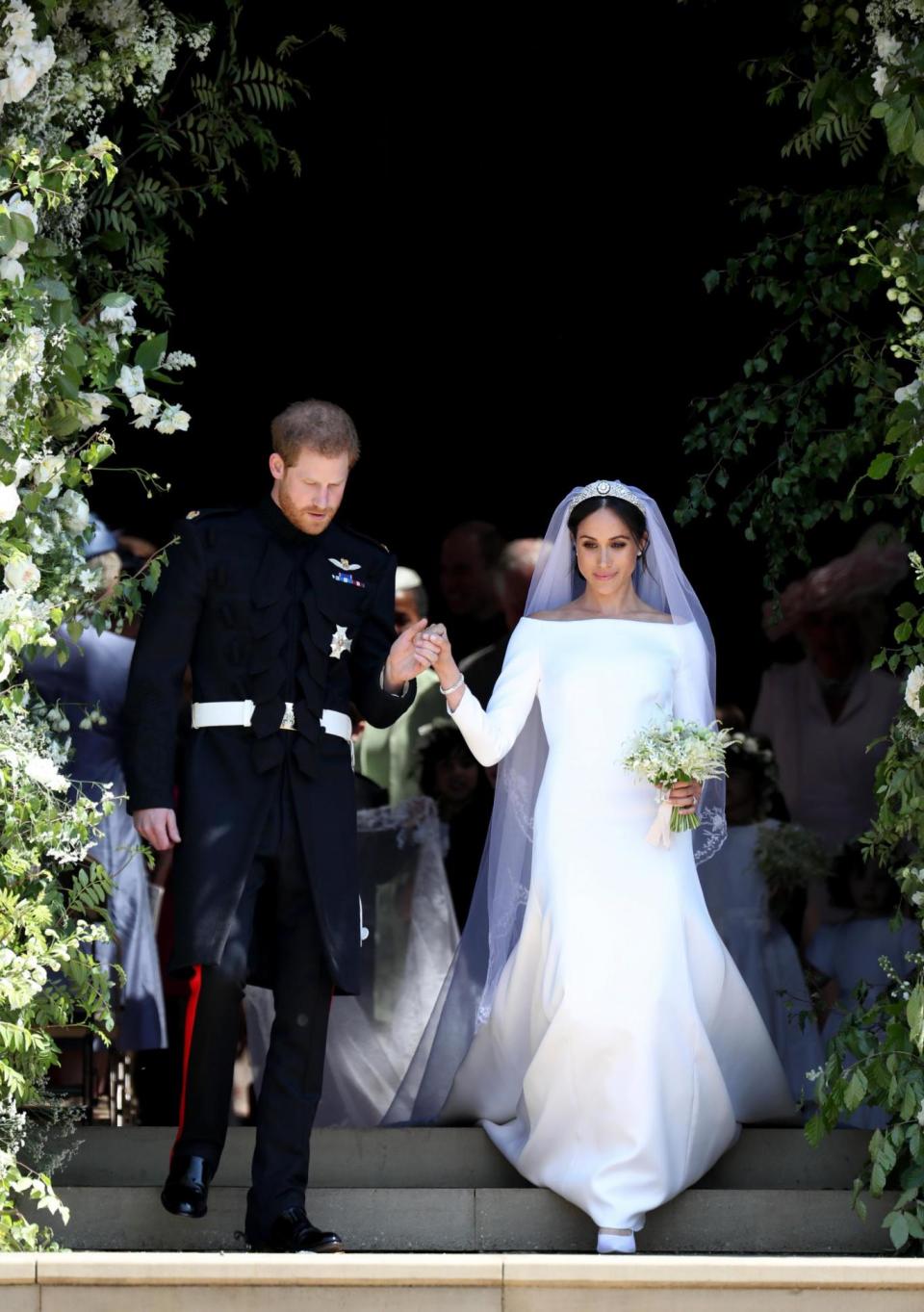 Prince Harry and Meghan Markle leave St George's Chapel in Windsor Castle after their wedding. (PA Wire/PA Images)