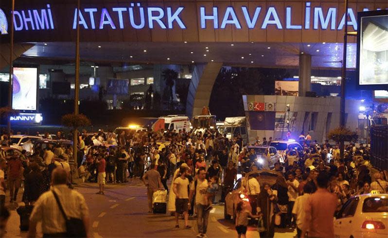 People can be seen fleeing the Ataturk airport in Turkey following suicide blasts. Photo: REUTERS/Osman Orsal