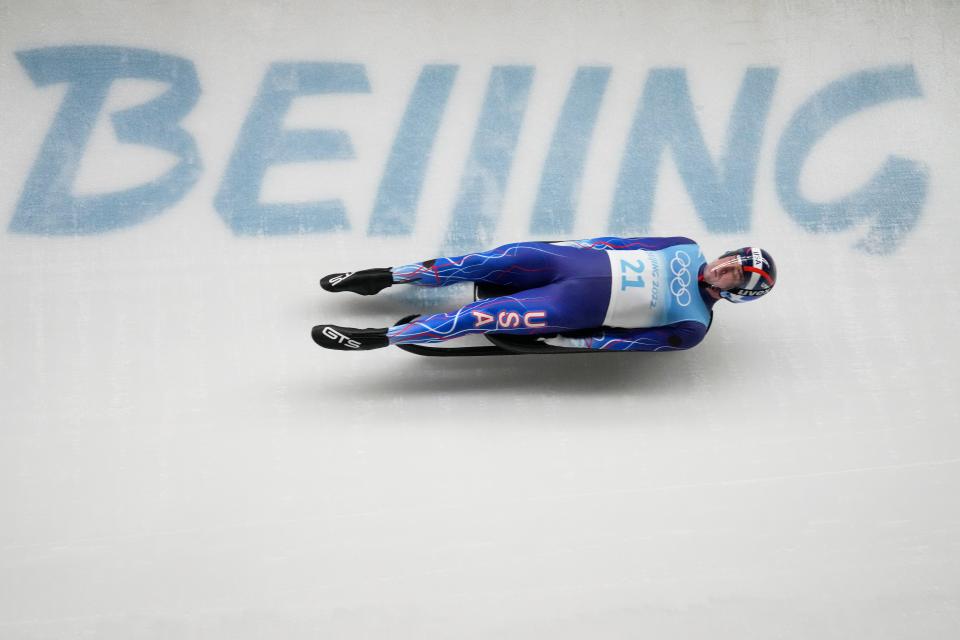 Tucker West, of the United States, slides during the luge men's single final run at the 2022 Winter Olympics, Sunday, Feb. 6, 2022, in the Yanqing district of Beijing.(AP Photo/Dmitri Lovetsky)