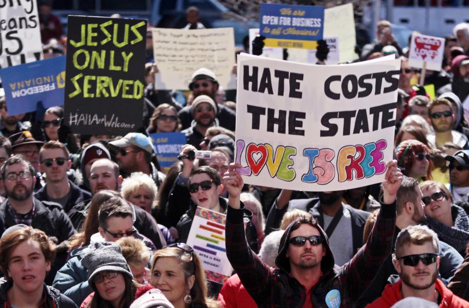 Demonstrators gather at Monument Circle to protest a controversial religious freedom bill recently signed by Governor Mike Pence, during a rally in Indianapolis March 28, 2015. More than 2,000 people gathered at the Indiana State Capital Saturday to protest Indiana's newly signed Religious Freedom Restoration Act saying it would promote discrimination against individuals based on sexual orientation. (REUTERS/Nate Chute)