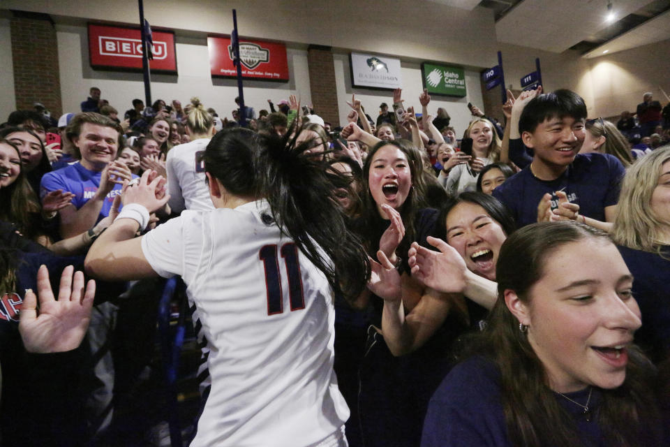 Gonzaga guard Kayleigh Truong (11) and her teammates celebrate with fans in the stands after the team's win against Utah in a second-round college basketball game in the NCAA Tournament in Spokane, Wash., Monday, March 25, 2024. (AP Photo/Young Kwak)