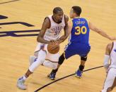 May 22, 2016; Oklahoma City, OK, USA; Oklahoma City Thunder forward Kevin Durant (35) dribbles as Golden State Warriors guard Stephen Curry (30) defends during the second quarter in game three of the Western conference finals of the NBA Playoffs at Chesapeake Energy Arena. Mandatory Credit: Mark D. Smith-USA TODAY Sports