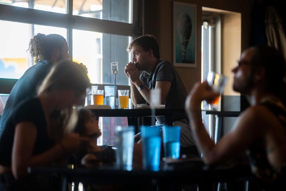Customers eat and drink at Craft House restaurant and bar at Railroad Square on Wednesday, Sept. 21, 2022 in Tallahassee, Fla. 