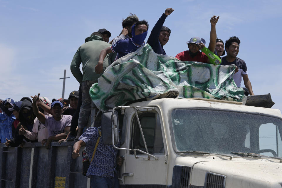 Supporters of ousted Peruvian President Pedro Castillo arrive in a truck to help block the Pan-American South Highway in Ica, Peru, Tuesday, Dec. 13, 2022. Castillo said Tuesday he is being "unjustly and arbitrarily detained" and thanked his supporters for their "effort and fight" since he was taken into custody on Dec. 7. (AP Photo/Martin Mejia)