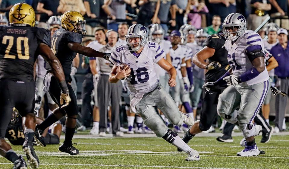 Jesse Ertz rushes to gain a first down during the final moments of a 14-7 Vanderbilt victory over Kansas State (Photo by Frederick Breedon/Getty Images)