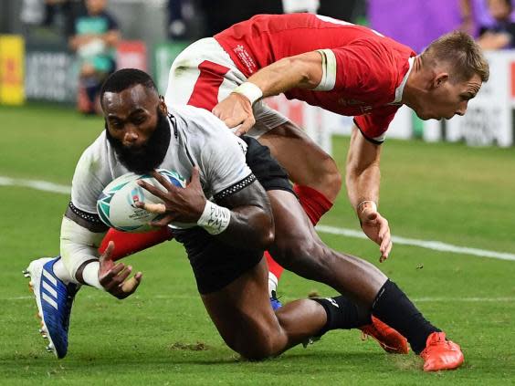 Fiji's Semi Radradra is tackled by Wales' Liam Williams (Getty)