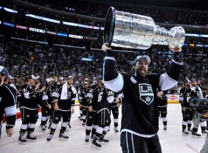 Kings winger Justin Williams hoists the Stanley Cup after defeating the Rangers in Game 5 of the 2014 Stanley Cup Final at Staples Center. (USA Today)