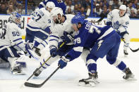 Tampa Bay Lightning center Ross Colton (79) watches his goal get past Toronto Maple Leafs goaltender Erik Kallgren (50) and center Colin Blackwell (11) during the second period of an NHL hockey game Thursday, April 21, 2022, in Tampa, Fla. (AP Photo/Chris O'Meara)