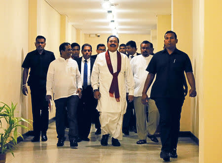 Sri Lanka's newly appointed Prime Minister Mahinda Rajapaksa arrives at the parliament in Colombo, Sri Lanka November 29, 2018. REUTERS/Dinuka Liyanawatte/Files