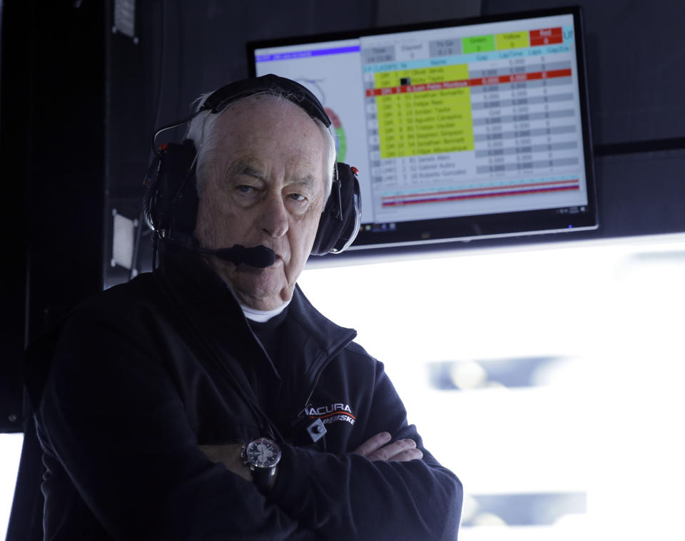 FILE - In this Jan. 26, 2019, file photo, Penske Acura team owner Roger Penske monitors his Acura DPi cars on the track from his pit stall at the IMSA 24-hour race at Daytona International Speedway in Daytona Beach, Fla. Penske’s drivers swept all the races at Indianapolis Motor Speedway and his reward has been induction into the NASCAR Hall of Fame. Penske will be honored Friday night along with Jeff Gordon, deceased drivers Davey Allison and Alan Kulwicki and fellow team owner Jack Roush. (AP Photo/Terry Renna, File)