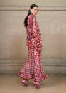 <p>Long dress in silk chiffon printed with a pink and red tartan pattern, delicate plissé soleil at the waist, neck and hem and embellished with red mirror-effect crystals. (Photo: Courtesy of Givenchy) </p>