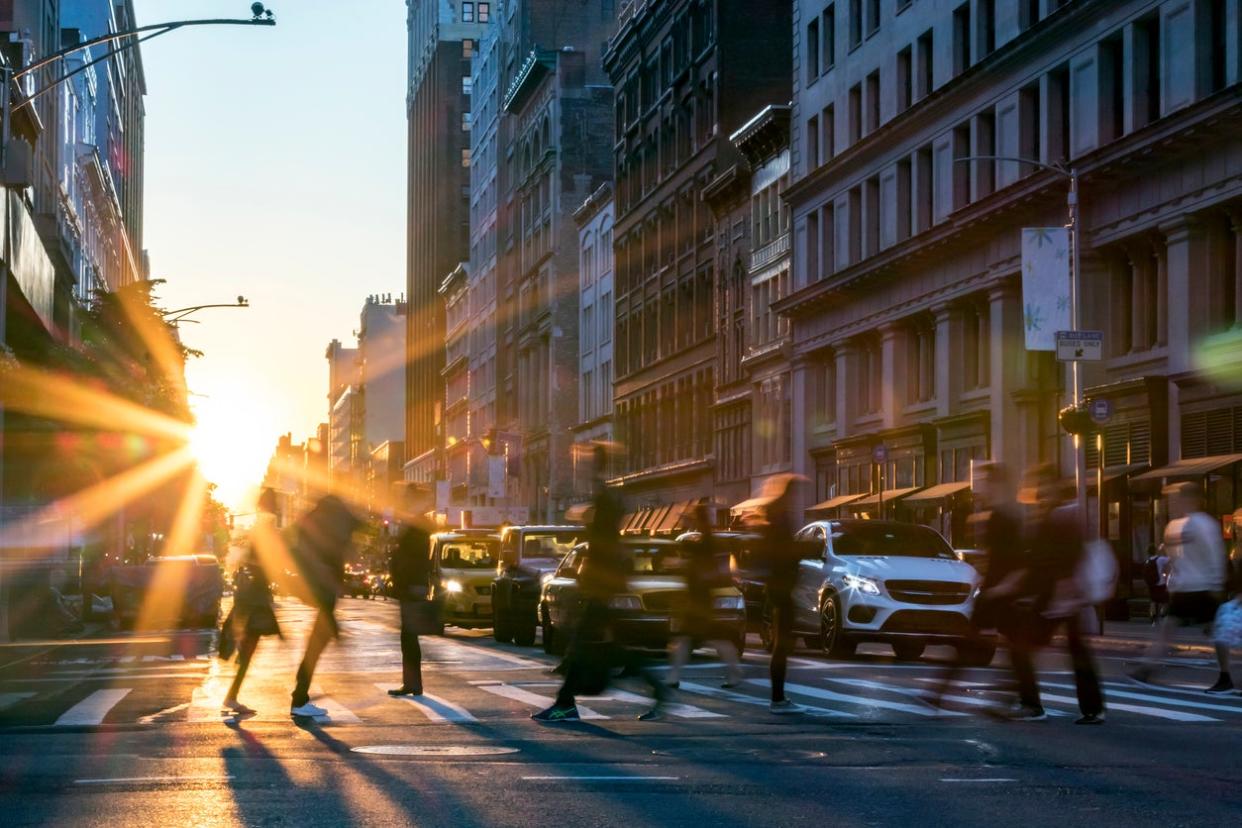 busy street with people walking through city