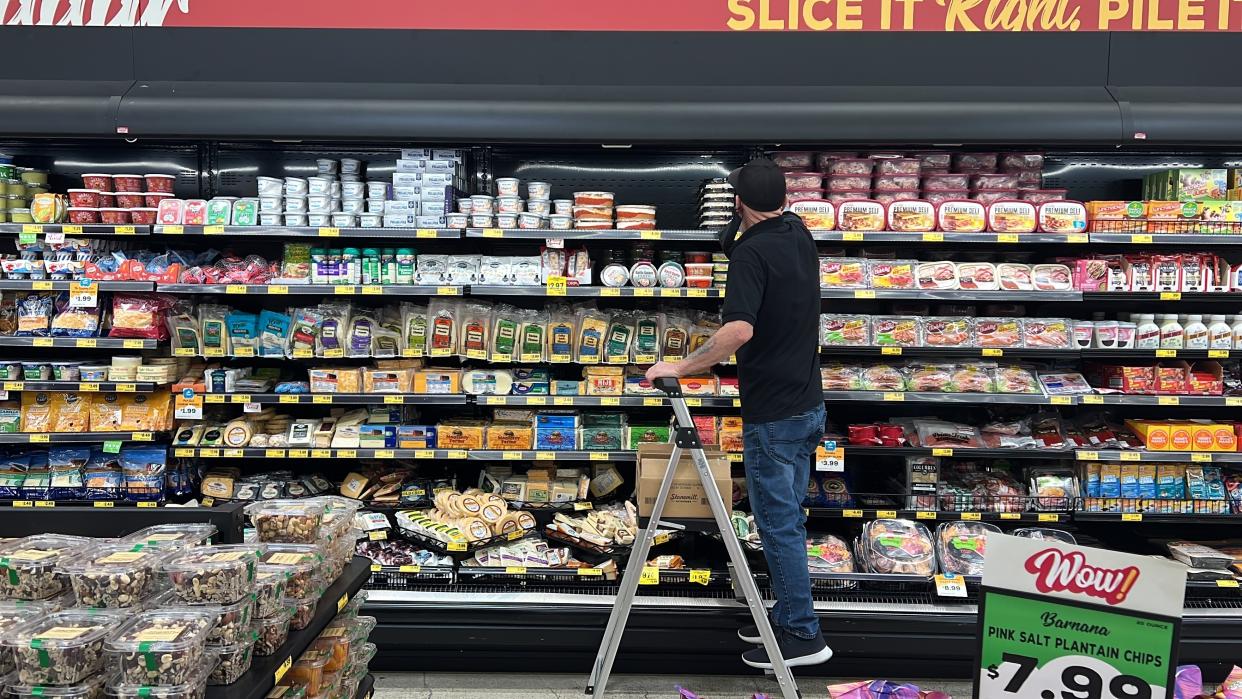 An employee stocks refrigerated items at a Grocery Outlet store in Pleasanton, Calif., on Thursday, Sept. 15, 2022. "Best before” labels are coming under scrutiny as concerns about food waste grow around the world. Manufacturers have used the labels for decades to estimate peak freshness. But “best before” labels have nothing to do with safety, and some worry they encourage consumers to throw away food that’s perfectly fine to eat. (AP Photo/Terry Chea)