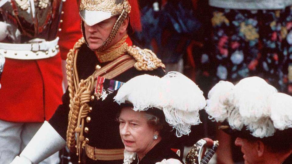 Andrew Parker Bowles in regimental uniform alongside Queen Elizabeth II