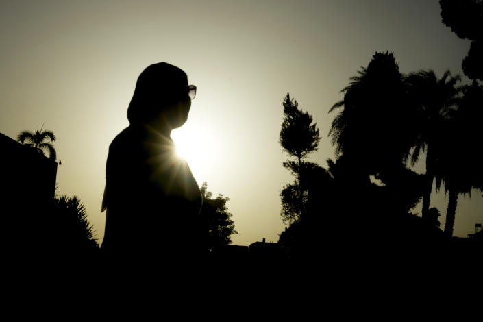 A 34-year-old Egyptian woman, who asked to be identified as N.S., visits a garden in Cairo, Egypt, Sept. 29, 2022. She remembers it all: How female relatives held her down when she was 11, legs spread and genitals exposed. The fear that stiffened her body. The stranger in black holding the scissors. And the pain. “I had a feeling of being incomplete and that I will never feel happy because of this,” she said. “It’s a horrible feeling.” (AP Photo/Amr Nabil)