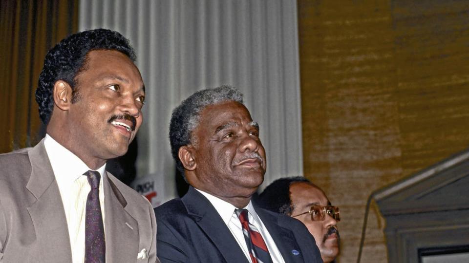 <div>Reverend Jesse Jackson sits next to incumbent Chicago Mayor Harold Washington at his primary election victory celebration over Jane Byrne thus winning the Democratic nomination for mayor which he easily won reelection in the general election the following April. Chicago, Illinois, February 24, 1987 (Photo by Mark Reinstein/Corbis via Getty Images)</div>