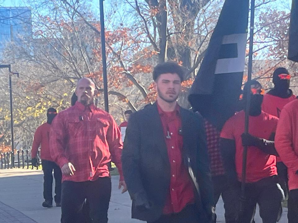 Members of neo-Nazi group "Blood Tribe" march in downtown Madison on Saturday, Nov. 18, 2023. The man on the left appears to be Christopher Pohlhaus, a former U.S. Marine turned Blood Tribe leader, based on matching facial tattoos.