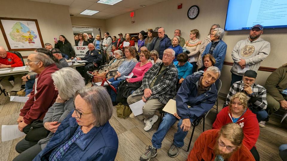 People spilled over into the lobby of Manchester Township Supervisors meeting Tuesday as they packed in to protest the possibility of a warehouse on land adjacent to and once owned by Prospect Hill Cemetery that was rezoned to allow a warehouse.