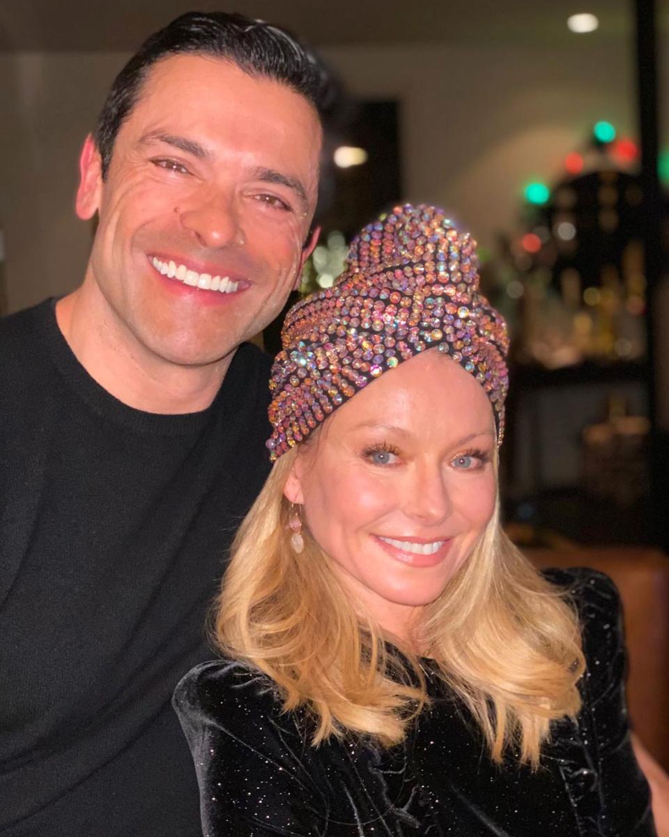 Kelly Ripa wears a glitter turban with Mark Consuelos