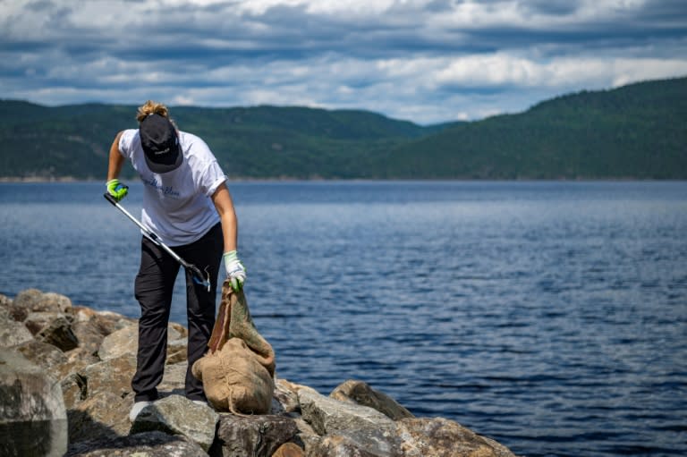 Viridiana Jimenez, a marine biologist with Reseau Quebec Maritime, collects trash near L'Anse-Saint-Jean (Sebastien ST-JEAN)