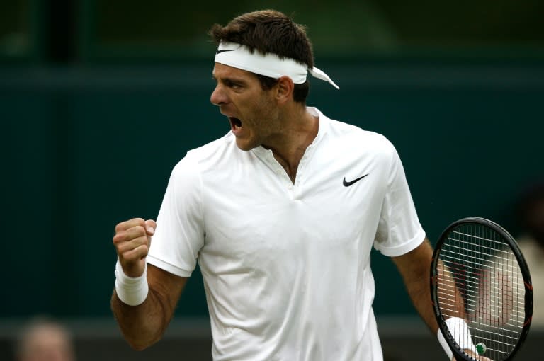 Argentina's Juan Martin del Potro celebrates after breaking Switzerland's Stan Wawrinka during their men's singles second round match on the fifth day of the 2016 Wimbledon Championships, on July 1, 2016