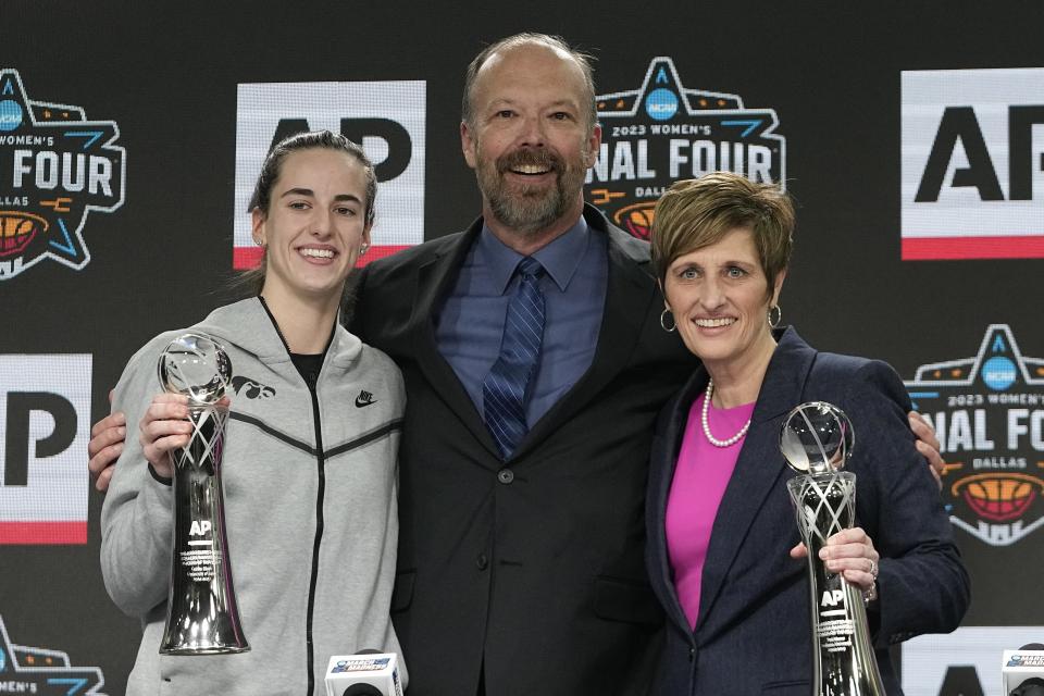 Associated Press Sports Products Director Barry Bedlan is flanked by Indiana head coach Teri Moren and Iowa's Caitlin Clark at a press conference after both was introduced as the AP Coach of the Year and AP Player of the Year Thursday, March 30, 2023, in Dallas. (AP Photo/Darron Cummings)