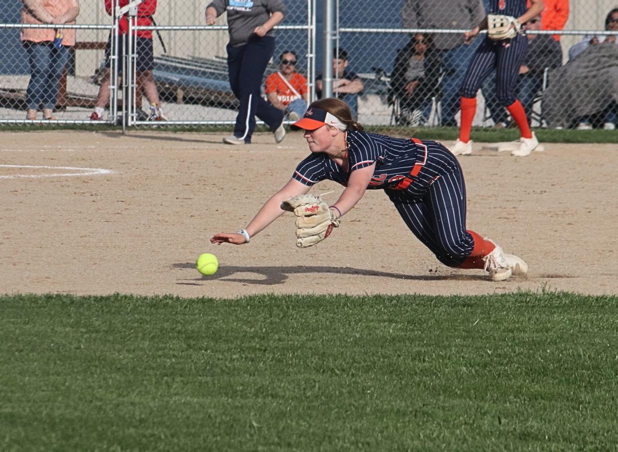 Pontiac second baseman Kendall Pitchford dives to try to make a stop of a grounder Thursday against Prairie Central.