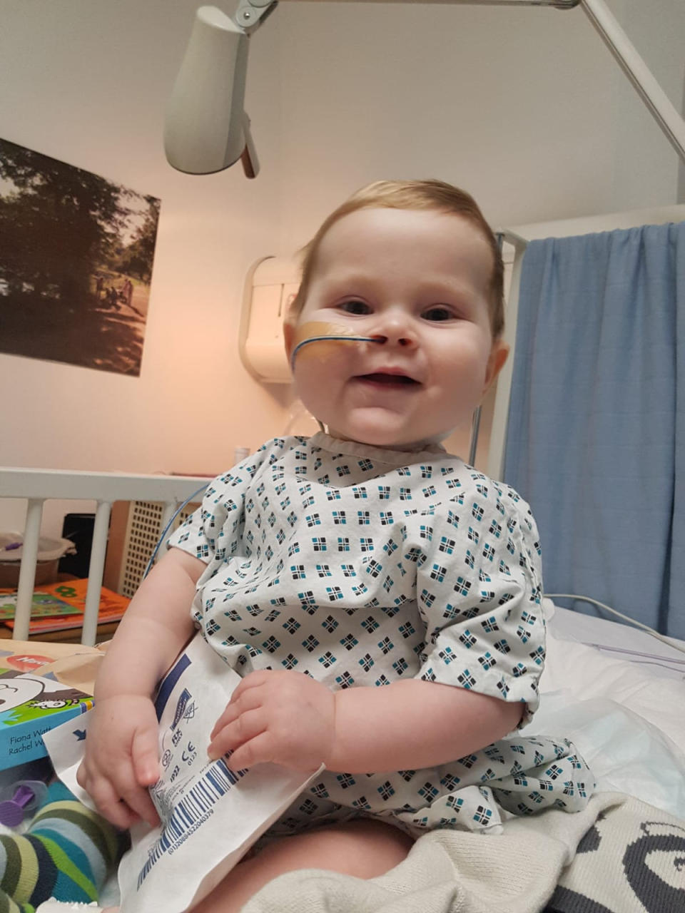 Callan Price, now 17 months old, at the Evelina Children's hospital in London 6 days aftyer his transplant. See SWNS copy SWCAliver: A baby who was poisoning his own brain was saved by his dad who underwent a 10-hour operation to donate part of his liver. Little Callan Price, now 17-months-old, was rushed away by doctors when he was first born and fell into a coma when he was four-days-old. His distraught parents Matt Price, 39 and his wife Jen Price, 36, were told the devastating news that their baby boy may not make it through the night. 