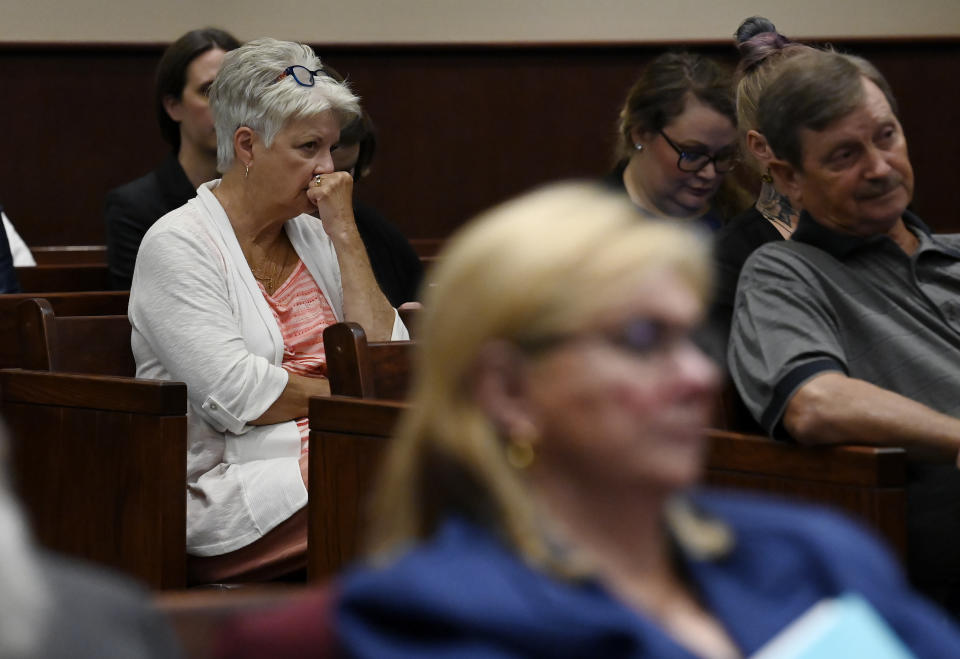 Family members of the victims listen to Sumner County District Attorney Lawrence Ray Whitley speak during a court hearing for Michael Cummins at the Sumner County Justice Center on Wednesday, Aug. 16, 2023, in Gallatin Tenn. Cummins who killed eight people in rural Westmoreland over several days in April 2019, has pleaded guilty to eight counts of first-degree murder in exchange for a sentence of life without parole. (Mark Zaleski/The Tennessean via AP, Pool)