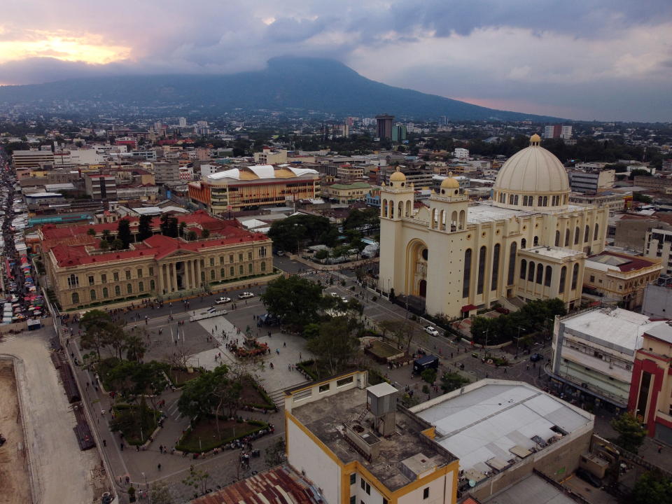 A general view shows the National Palace building and the National Cathedral in downtown San Salvador, El Salvador April 25, 2022. Picture taken with a drone. REUTERS/Jose Cabezas