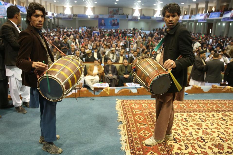 In this photo taken on Wednesday, April 2, 2014, Afghan drummers perform during Afghan presidential candidate, Zalmai Rassoul's campaign in Kabul, Afghanistan. (AP Photo/Massoud Hossaini)