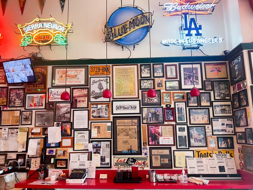 Memorabilia on the wall at Village Pizzeria. Photo courtesy of Steve Cohen.