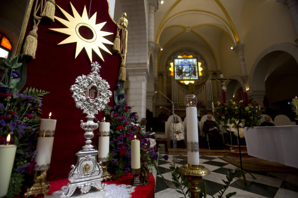 A wooden relic believed to be from Jesus' manger is seen in the Church of the Nativity, traditionally believed by Christians to be the birthplace of Jesus Christ in the West Bank city of Bethlehem, Saturday, Nov. 30, 2019. A tiny wooden relic believed to have been part of Jesus' manger has returned to its permanent home in the biblical city of Bethlehem 1,400 years after it was sent to Rome as a gift to the pope. (AP Photo/Majdi Mohammed)