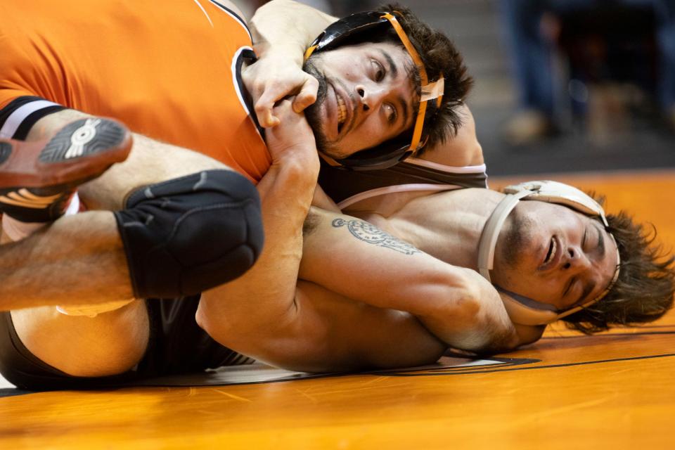 Lehigh's Josh Humphreys holds Oklahoma State's Wyatt Sheets during Sunday's match.