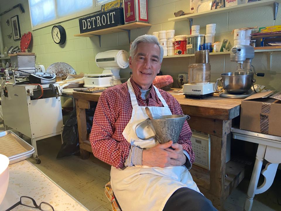 Nick Corden in the back room of Corden Chocolates in Inkster, holding his late father's funnel used for chocolate making at the family-run business for more than 100 years.