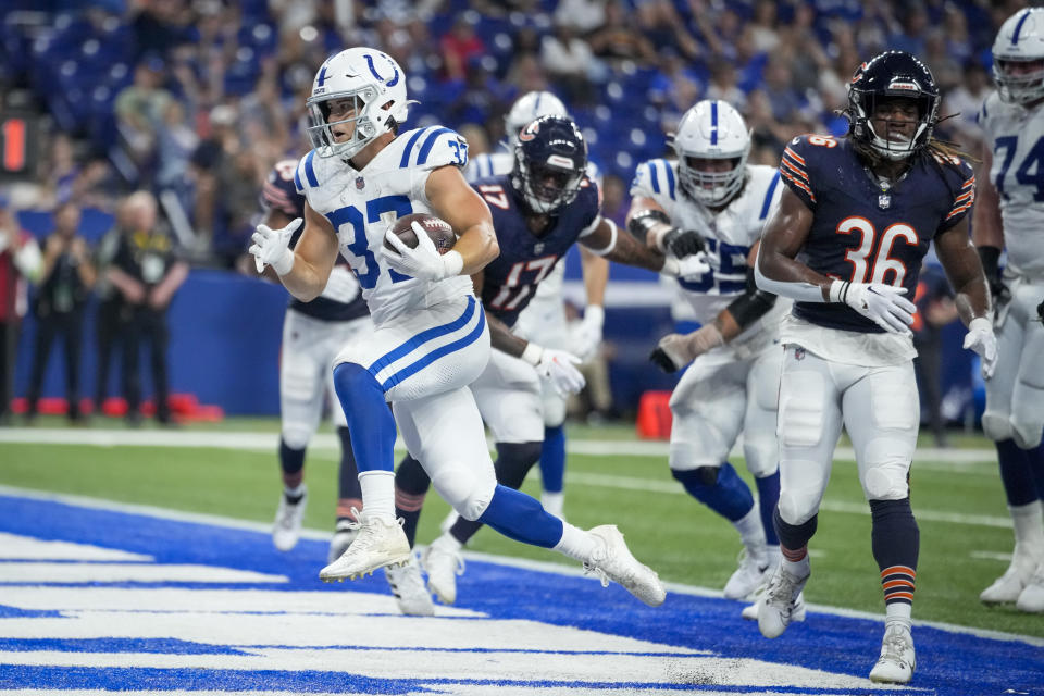 Indianapolis Colts running back Jake Funk (37) scores a touchdown against the Chicago Bears during the second half of an NFL preseason football game in Indianapolis, Saturday, Aug. 19, 2023. (AP Photo/Michael Conroy)