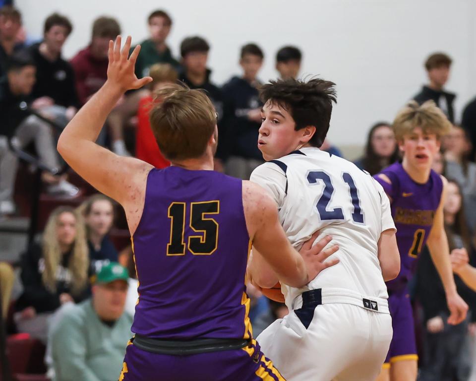 St. Thomas Aquinas' Will Mollica is pressured from Mascoma's Tyler-Jay Mardin during Wednesday's Division III boys basketball semifinal at Goffstown High School.