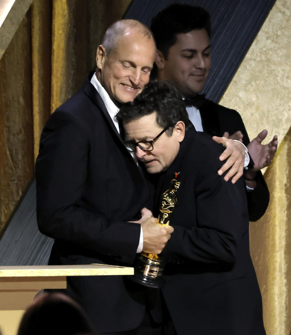 Woody Harrelson congratulates Michael J. Fox, winner of the Jean Hersholt Humanitarian Award, onstage during the Academy of Motion Picture Arts and Sciences 13th Governors Awards at Fairmont Century Plaza on November 19, 2022 in Los Angeles, California. (Photo by Kevin Winter/Getty Images)