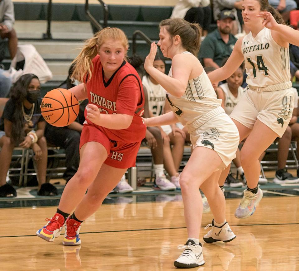 Tavares’ Riley Miller (24) goes to the basket during Monday's game against The Villages in The Villages. Miller scored four points for Bulldogs.. [PAUL RYAN / CORRESPONDENT]