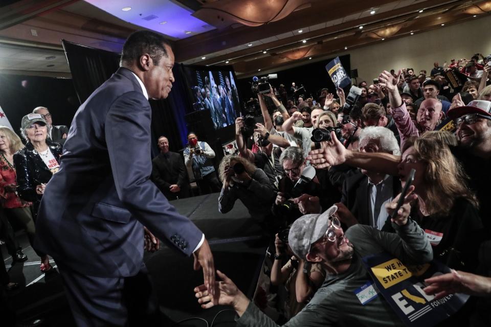 Larry Elder greets supporters at an election night party at the Hilton in Costa Mesa.