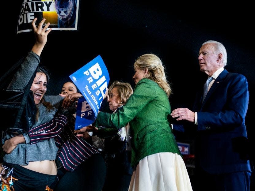 Jill Biden fights off protestors that got up on the stage during a Super Tuesday election night party in Los Angeles, California.