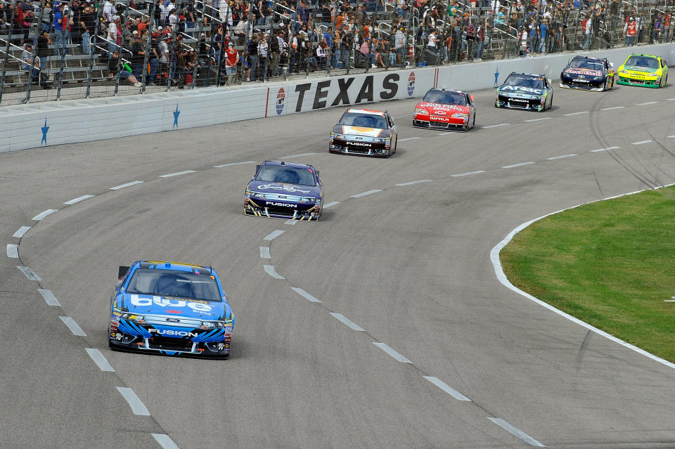 FORT WORTH, TX - NOVEMBER 06: Greg Biffle, driver of the #16 3M Scotch-Blue Painter's Tape Ford, leads Matt Kenseth, driver of the #17 Crown Royal Ford, during the NASCAR Sprint Cup Series AAA Texas 500 at Texas Motor Speedway on November 6, 2011 in Fort Worth, Texas. (Photo by Jared C. Tilton/Getty Images for NASCAR)
