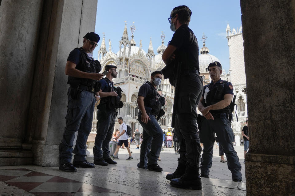 Policemen patrol St.Mark's Square during a G20 meeting of Economy and Finance ministers and Central bank governors in Venice, Italy, Thursday, July 8, 2021. (AP Photo/Luca Bruno)