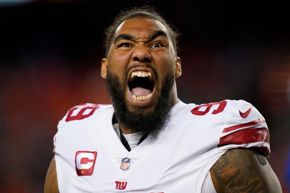 New York Giants defensive end Leonard Williams yells to fans before the start of a game against the Commanders.