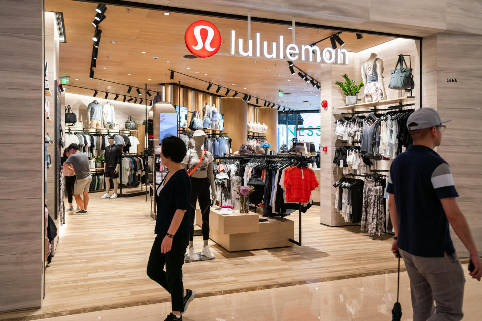 SHANGHAI, CHINA - 2019/07/19: Pedestrians seen walking past Canadian athletic apparel retailer Lululemon store in Shanghai. (Photo by Alex Tai/SOPA Images/LightRocket via Getty Images)