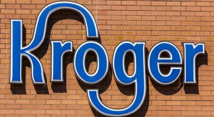 A Kroger (KR) logo on a building.