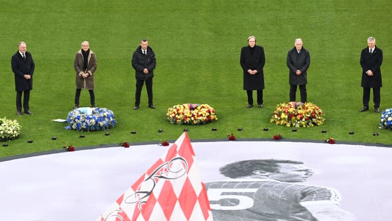 Former professional footballers Karl-Heinz Rummenigge, Wolfgang Overath, Lothar Matthaeus, Guenter Netzer, Karl-Heinz "Charly" Koerbel and Bastian Schweinsteiger take part in the memorial service for the late legendary footballer Franz Beckenbauer in the Allianz Arena. Sven Hoppe/dpa