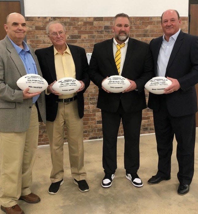 From left to right: Mel Maxfield, Larry Dippel, Chad Dunnam and Brad Thiessen were presented with commemorative footballs on Saturday, Jan. 29, 2022, at the AHS football banquet. During the 2021 Amarillo High football season, the Sandies won their 800th career game.