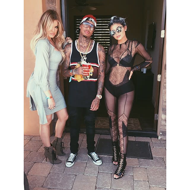 Is this what the 17 year olds are wearing these days? Kylie Jenner managed to one-up herself and even her sister's skin-baring styles when she celebrated the second weekend of the Coachella Valley Music and Arts Festival in Indio, Calif. by wearing a strange see-through, black bikini number. <strong> VIDEO: Kylie Jenner Says She Wants Kids in 10 Years </strong> With her curves on FULL display, Kylie added to the outfit by wearing gray braid extensions and huge sunglasses. She chose this outfit for her sister Khloe Kardashian's pool party that she called "Chella." <strong> PHOTOS: See the Star Styles at Coachella! </strong> In another pic, Kylie is posing with her older sis and her rumored 25-year-old boyfriend, rapper Tyga. But that wasn't the only scantily-clad style the <em>Keeping Up with the Kardashians </em>star chose to share on Instagram during her desert weekend. She also posted front and rear pics of her wearing a skimpy black bikini. In her next Instagram, Kylie debuted a boots-and-pantsless combo that she paired with pink hair. Upon her return to Calabasas, the teenage reality star couldn't help but post another bikini pic. "Chill pool day at the Disick mansion," she wrote while at her sister Kourtney's 36th birthday bash. <strong>What do you think of Kylie's style statements? Are they age appropriate?</strong>