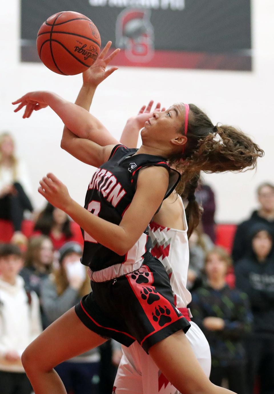 Norton's Dakota Graham is fouled on her way to the basket on Dec. 8, 2022, in Springfield.